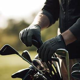 High handicap golfer testing forgiving irons at a driving range